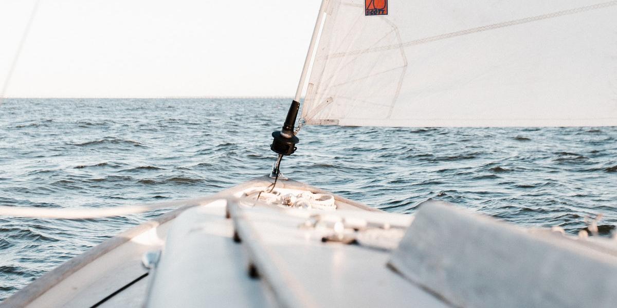 View of sea from tip of sailboat.