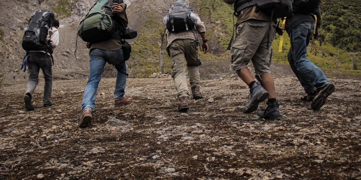 Group walking along a hill.