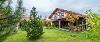 Holiday cottage amongst some trees and grass at Ribby Hall.
